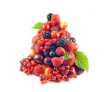 stack of fresh berries and fruit isolated