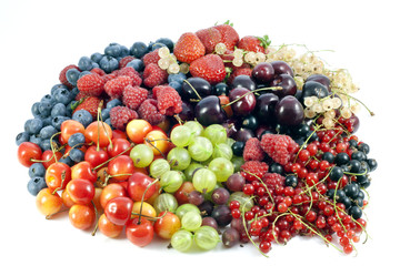assortment of fresh berries and fruit on white background
