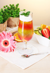 fruit jelly in glass and fruits on table in cafe