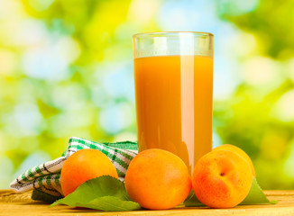 glass of apricot juice and fresh apricots