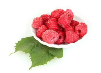 Fresh raspberries in white saucer isolated on white