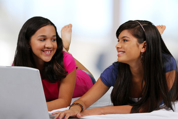 Teenager On Her Bed With Friend
