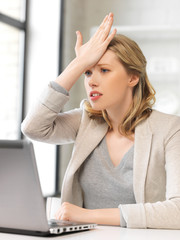 stressed woman with laptop computer