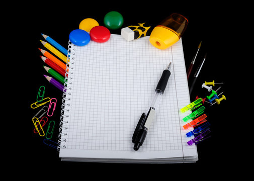 School education supplies items isolated on a black background