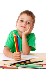 Little boy draw with crayons
