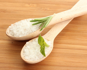 salt in spoons with fresh  rosemary and basil