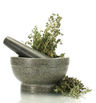 mortar with fresh green thyme isolated on white