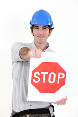 Construction worker with a stop sign