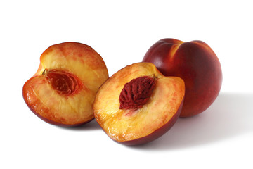Composition of fresh peaches isolated on white