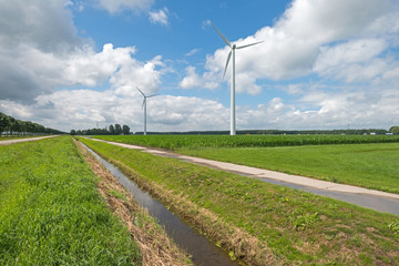 Ditch and wind turbines in the countryside