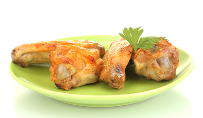 roasted chicken wings with parsley in the plate isolated