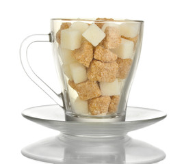 white refined sugar and Lump brown cane sugar cubes in glass