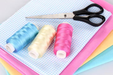 Sewing accessories and fabric isolated on white