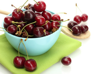 Ripe cherry berries in bowl isolated on white