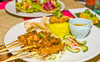 delicious chicken satay on skewers