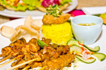 delicious chicken satay on skewers