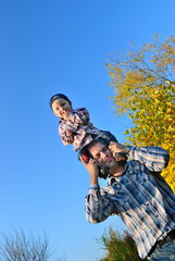 Dad rolls the child's neck
