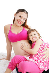Beautiful pregnant woman with her daughter