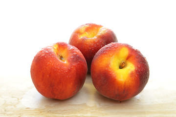 Fototapeta na wymiar Group of three fresh peaches