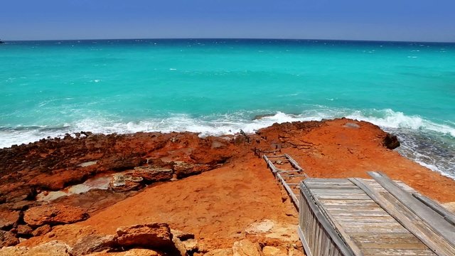 beautiful rocky escalo beach in balearic islands