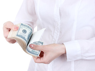 Fake American dollars in a women hands on a white background.