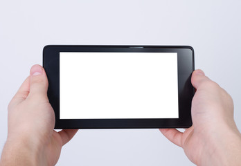hands holding tablet