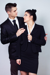 modern young business couple look at each other and posing