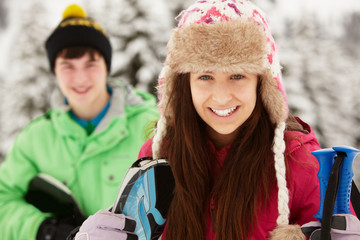 Two Teenagers On Ski Holiday In Mountains