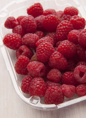 Red raspberries on white background without pips