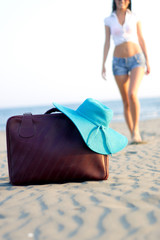 Brown Travel Vacation Suitcase on Beach