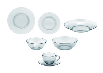Tableware. Glass plates, bowls and cups on a white background.
