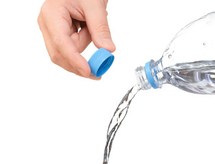 hand opened a bottle of water. water to pour from bottle