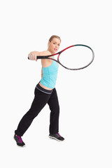 Woman playing tennis with a racket