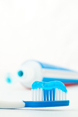 Toothpaste next to a toothbrush