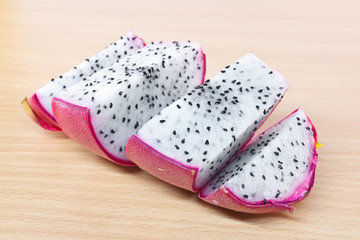 Dragon fruit on wooden cutting board