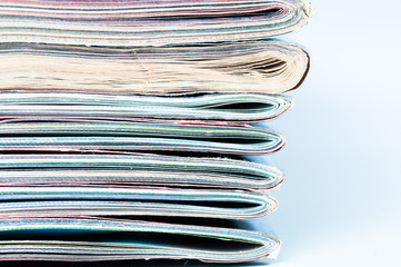 A large stack of magazines piled high.