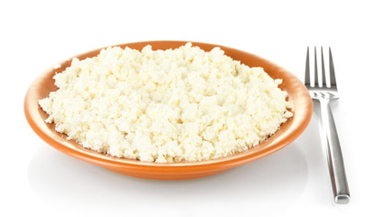 Cottage cheese in a plate with fork isolated on white