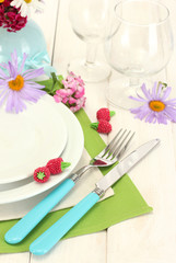 beautiful holiday table setting with flowers