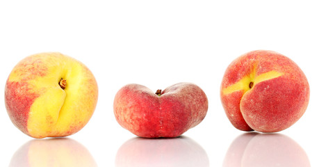 ripe peaches isolated on white.