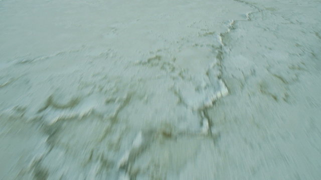 Aerial low angle view of the South Bay Salt Ponds 