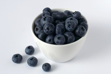 blueberries in a cup isolated on white
