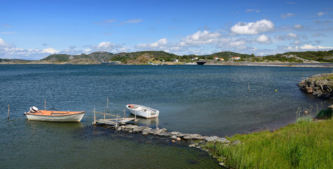 Sea bay panorama landscape with rowboats