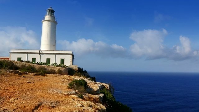 Formentera La Mola lighthouse in the blue Mediterranean sea