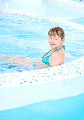 woman sitting in a pool