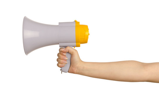 Hand holding loudspeaker on white