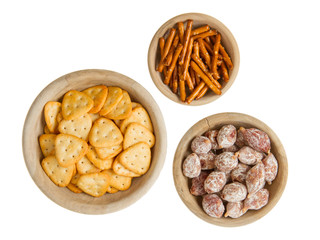 Italian salami and typical dutch salty snacks in wooden bowl