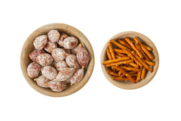 Italian salami and typical dutch salty snacks in wooden bowl