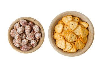 Italian salami and typical dutch salty snacks in wooden bowl