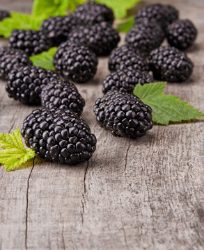 Fresh blackberries on wooden table