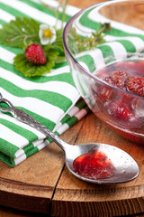 Silver spoon with strawberry jam